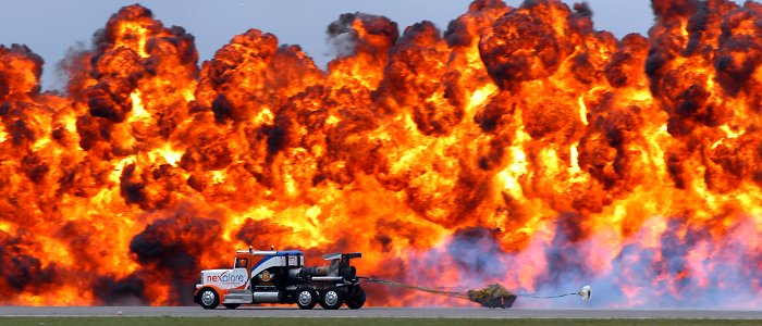 US Navy 070909-N-1082Z-039 The jet-propelled Shockwave Jet Truck speeds down the runway beside a pyrotechnics display during the 2007 Naval Air Station Oceana Air Show