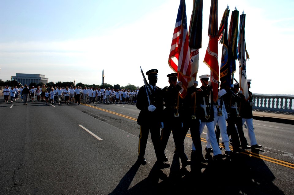 US Navy 070909-N-3642E-149 A military color guard leads America Supports You National Freedom Walk participants over the Memorial Bridge, toward Arlington, Va