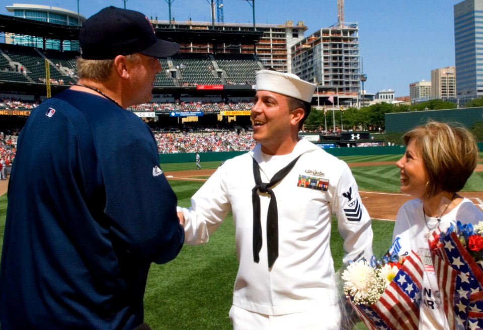 US Navy 070909-N-5319A-010 Fire Controlman 1st Class John Michael Broughton shakes hands with Boston Red Socks pitcher Curt Schilling before an Orioles-Red Sox game at Camden Yards