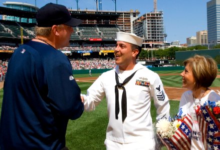 US Navy 070909-N-5319A-010 Fire Controlman 1st Class John Michael Broughton shakes hands with Boston Red Socks pitcher Curt Schilling before an Orioles-Red Sox game at Camden Yards