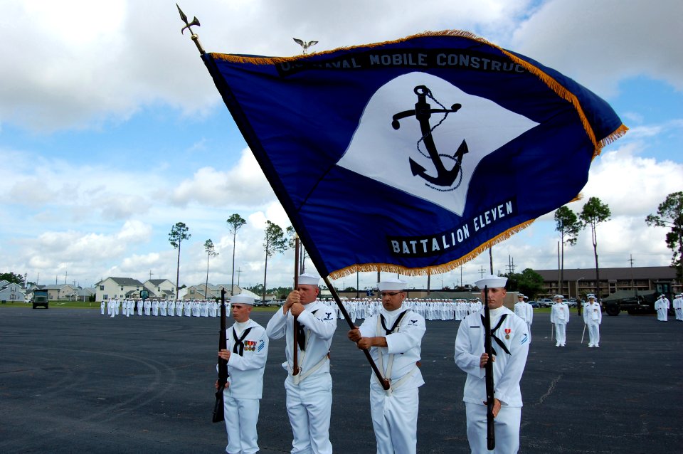US Navy 070914-N-1057H-363 Naval Mobile Construction Battalion (NMCB) 11's organizational colors wave for the first time since being decommissioned in December 1969