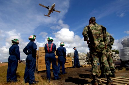 US Navy 070908-N-1810F-172 Nicaraguan soldiers and U.S. Navy Sailors combine efforts to deliver disaster relief supplies to Nicaraguans hit by Hurricane Felix photo