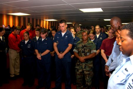 US Navy 070911-N-1831S-022 ailors aboard amphibious assault ship USS Kearsarge (LHD 3) take a moment of silence to remember the victims of the Sept. 11 terrorist attacks photo