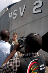 US Navy 070916-N-0989H-036 Capt. Douglas Wied, commander of Task Group 40.9, takes part in a interview with a journalist with CVM News, a national Jamaican television station, during a media availability upon High Speed Vessel photo