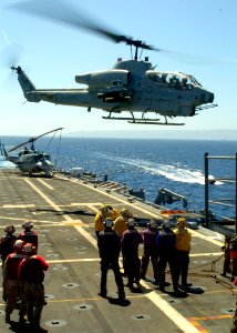 US Navy 070910-N-3925A-002 An AH-1 Cobra helicopter takes off from the flight deck of amphibious transport dock USS Cleveland (LPD 7)