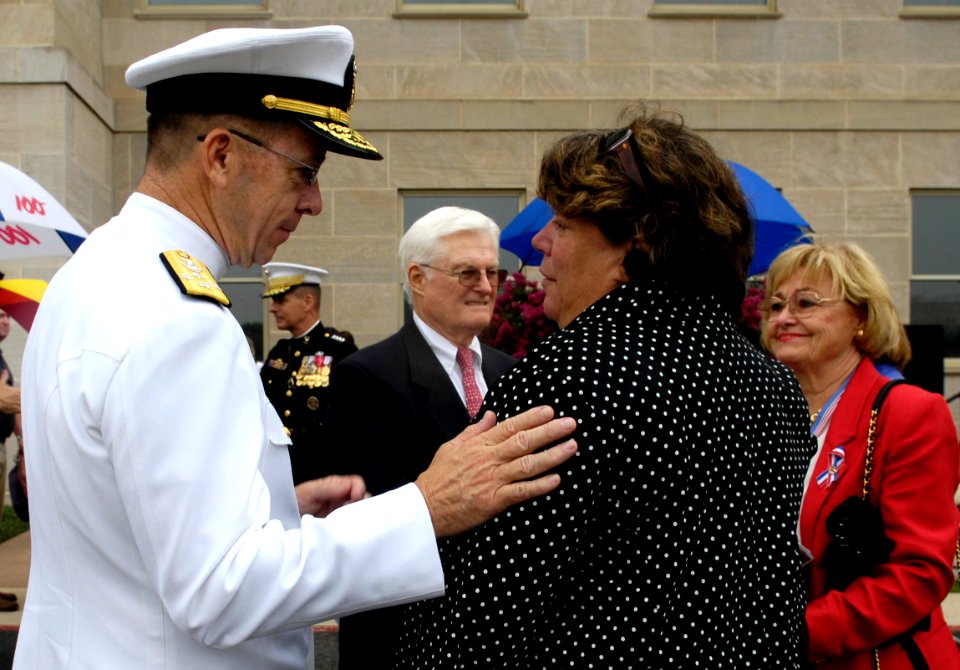 US Navy 070911-D-7203T-010 Chief of Naval Operations Adm. Mike Mullen speaks with family members during a Sept. 11 remembrance and wreath laying ceremony with at the Pentagon