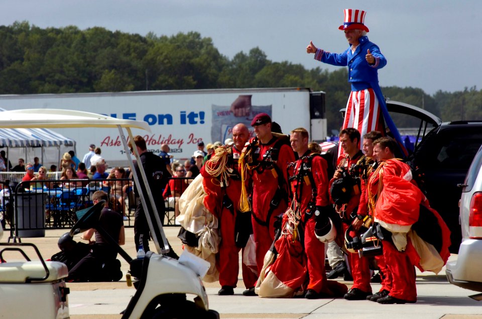 US Navy 070909-N-6676S-773 The British Red Devils Jump Team poses for photos with Steve Myott, Uncle Sam on Stilts, after a jump during the 2007 Naval Air Station Oceana Air Show