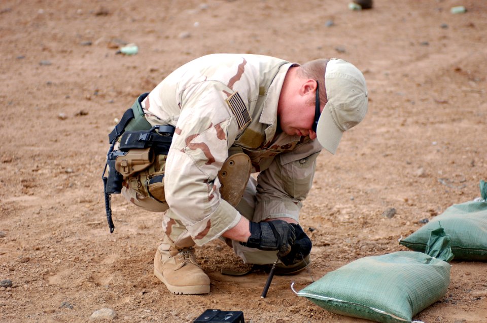 US Navy 070913-N-1003P-028 Lt. Erik Vik, officer-in-charge of Explosive Ordnance Disposal Mobile Unit 8, Det. 20, based in Sigonella, Italy, prepares the Arta range for the disposition of expired ammunition