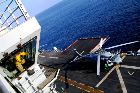US Navy 070918-N-4774B-103 Lt. Cmdr. Patrick J. Beam observes flight deck operations aboard amphibious assault ship USS Tarawa (LHA 1) from the primary flight control tower