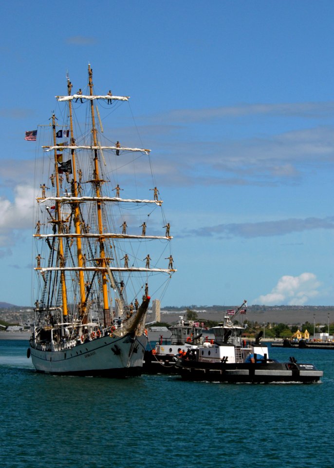 US Navy 070914-N-4965F-004 Tugboats assigned to Naval Station Pearl Harbor assist Indonesian naval training ship KRI Dewaruci as she prepares to moor at Naval Station Pearl Harbor