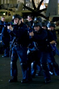 US Navy 070919-N-5387K-053 Shipboard reaction force trainees perform a drill in the hangar bay aboard USS Kitty Hawk (CV 63)