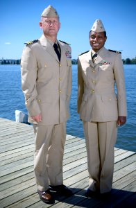 US Navy 070919-N-5319A-008 Two Sailors shows off the prototype uniform for service dress khaki, a throwback to the traditional WWII style uniform