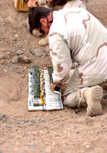 US Navy 070913-N-1003P-032 Senior Chief Eric Clark, of Explosive Ordnance Disposal Mobile Unit 8, Det. 20, based in Sigonella, Italy, prepares expired munitions for disposal