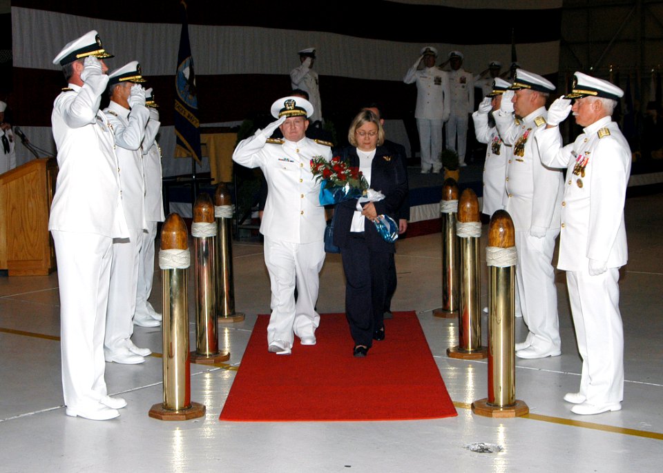 US Navy 070916-N-2716P-005 Rear Adm. Robert Passmore and his wife are piped over the side during a retirement ceremony aboard Naval Air Station Whidbey Island
