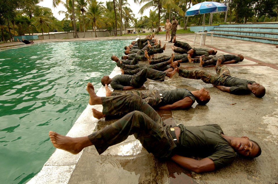 US Navy 070912-N-0989H-092 U.S. Marines assigned to a mobile training team conduct a series of water exercises and pad drills with members of the Dominican Defense Force during small unit training photo