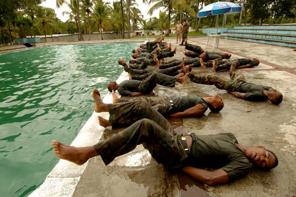 US Navy 070912-N-0989H-092 U.S. Marines assigned to a mobile training team conduct a series of water exercises and pad drills with members of the Dominican Defense Force during small unit training