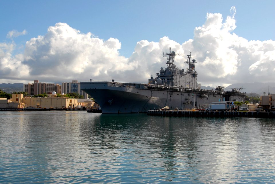 US Navy 070912-N-4965F-012 Tugboats assigned to Naval Station Pearl Harbor assist the amphibious assault ship USS Peleliu (LHA 5) as she prepares to moor pier side in Pearl Harbor