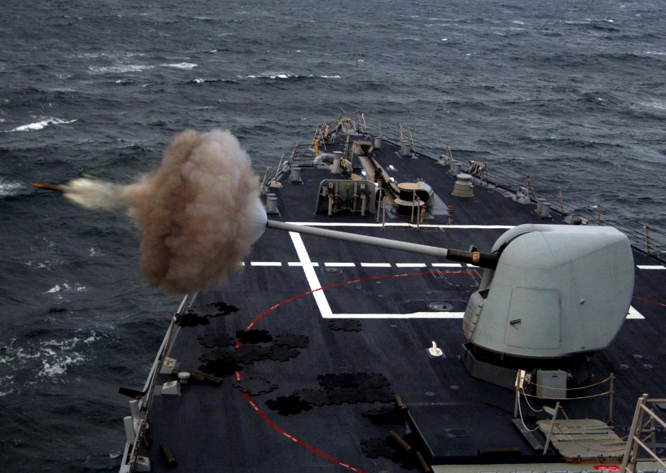 US Navy 070920-N-4236E-002 The five-inch, 54-caliber MK 45 Mod 2 gun mount aboard guided-missile destroyer USS McFaul (DDG 74) is fired during training operations at the Cape Wrath Gunnery Range