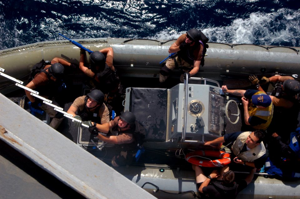 US Navy 070920-N-4014G-106 Members of the visit, board, search and seizure team assigned to guided-missile destroyer USS Porter (DDG 78) prepare to board Porter via hook and ladder during a training exercise