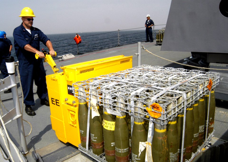 US Navy 070918-N-4649C-110 Gunner's Mate 1st Class Matt Kelly loads ordnance onto an elevator aboard Arleigh-Burke class guided-missile destroyer USS Lassen (DDG 82) during an ammunition onload