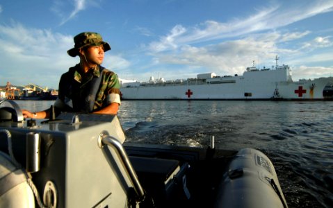 US Navy 070922-N-0194K-025 Master-at-Arms 2nd Class Rico Macaraeg, attached to Military Sealift Command hospital ship USNS Comfort (T-AH 20), patrols the waters around Comfort photo