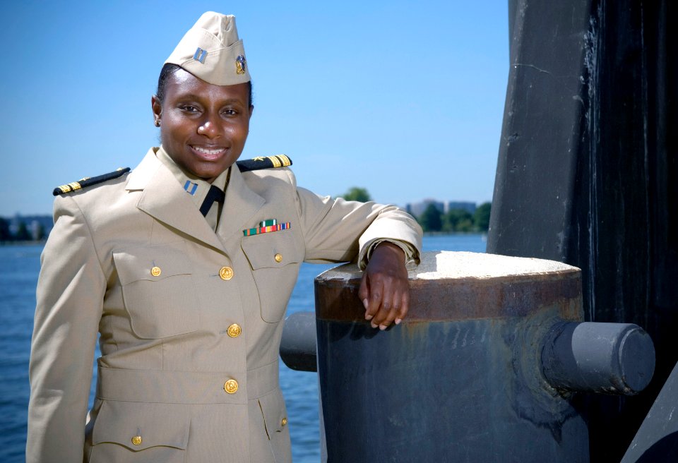 US Navy 070919-N-5319A-006 - Sailor shows off the prototype uniform for service dress khaki, a throwback to the traditional WWII style uniform