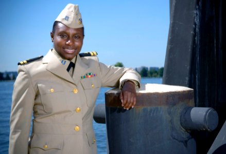 US Navy 070919-N-5319A-006 - Sailor shows off the prototype uniform for service dress khaki, a throwback to the traditional WWII style uniform