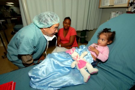 US Navy 070920-N-8704K-085 U.S. Public Health Service Rear Adm. Kenneth Moritsugu, acting U.S. surgeon general, speaks with a patient