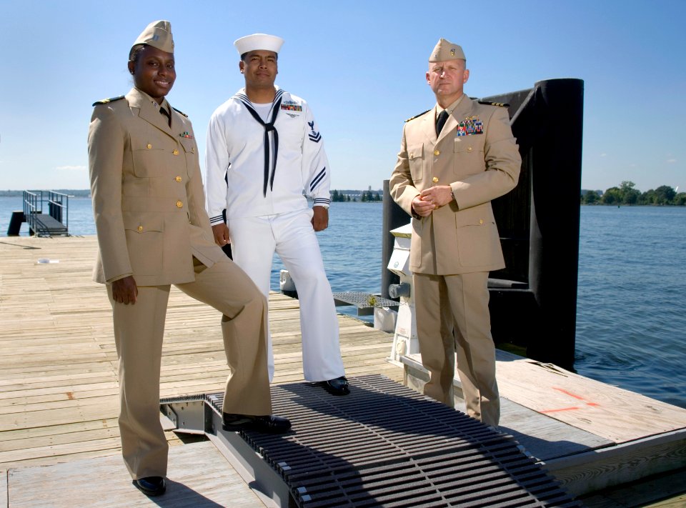 US Navy 070919-N-5319A-005 - Three sailors show off the prototype uniforms for service dress white and service dress khaki