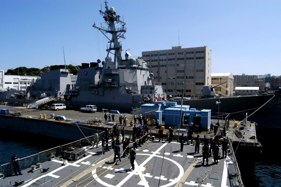 US Navy 070920-N-4649C-027 Sailors assigned to guided-missile destroyer USS Lassen (DDG 82) heave on the aft line as she performs a Mediterranean mooring evolution