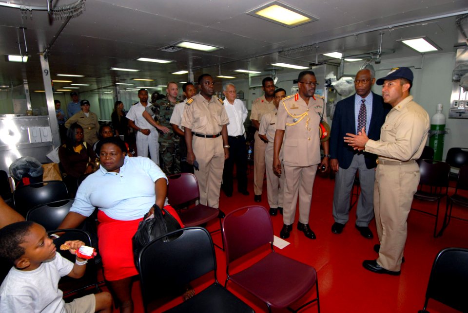 US Navy 070919-N-8704K-025 From right, Lt. Cmdr. Manuel Santiago, casualty and receiving division officer aboard Military Sealift Command hospital ship USNS Comfort (T-AH 20), guides Dr. Roy Austin, U.S. ambassador to Trinidad