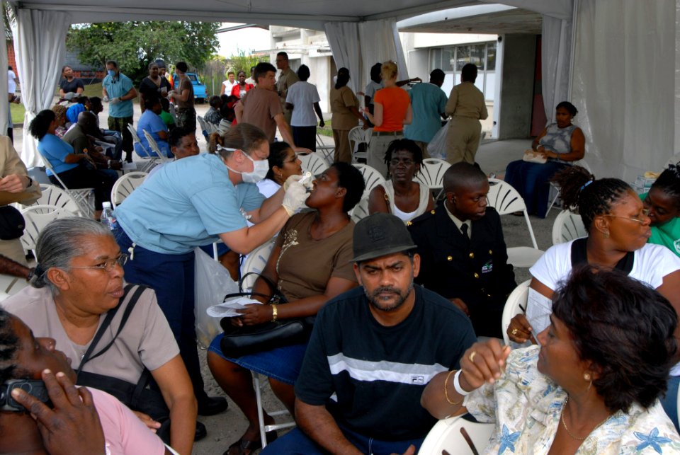 US Navy 070917-N-8704K-091 Hospital Corpsman 2nd Class Salina Ogg, attached to Military Sealift Command hospital ship USNS Comfort (T-AH 20), gives fluoride treatments to patients at the Arima Health Facility