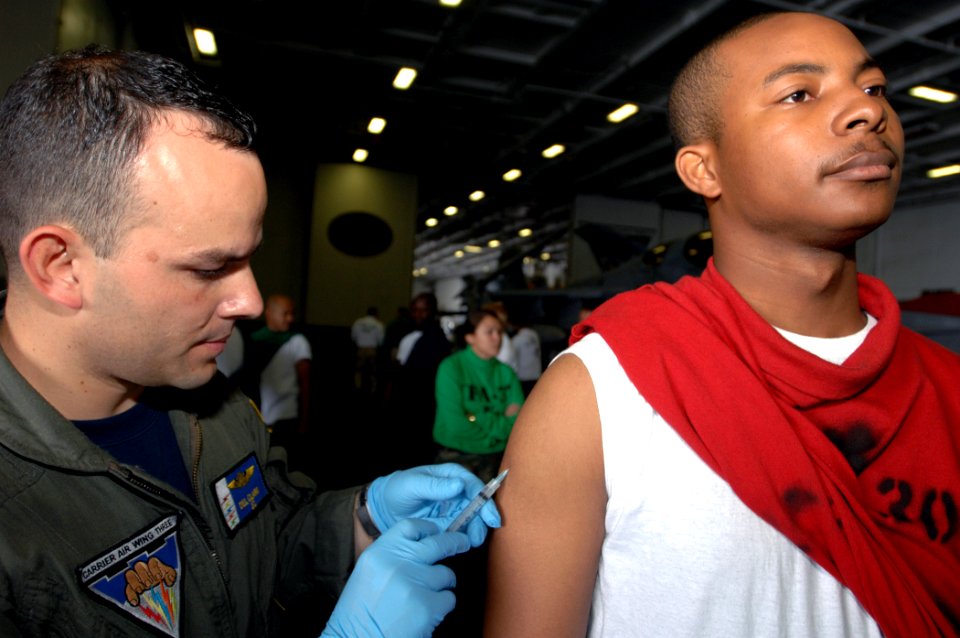 US Navy 070920-N-0455L-031 Lt. Del Clark administers an anthrax vaccine to a Sailor aboard Nimitz-Class aircraft carrier USS Harry S. Truman (CVN 75)