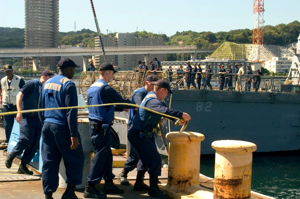 US Navy 070920-N-9520G-005 Sailors assigned to the guided-missile destroyer USS McCampbell (DDG 85) heave on the aft line as guided-missile destroyer USS Lassen (DDG 82) performs a Mediterranean mooring evolution