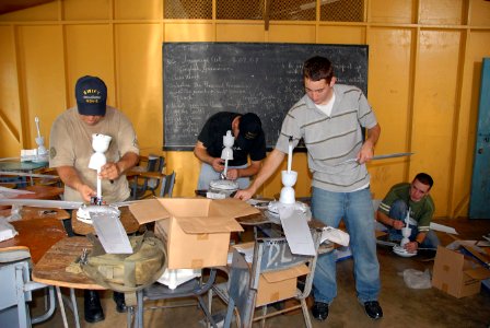 US Navy 070919-N-9486C-019 Sailors assigned to High Speed Vessel (HSV 2) Swift assemble ceiling fans during a community relations projects at Thichfield School photo