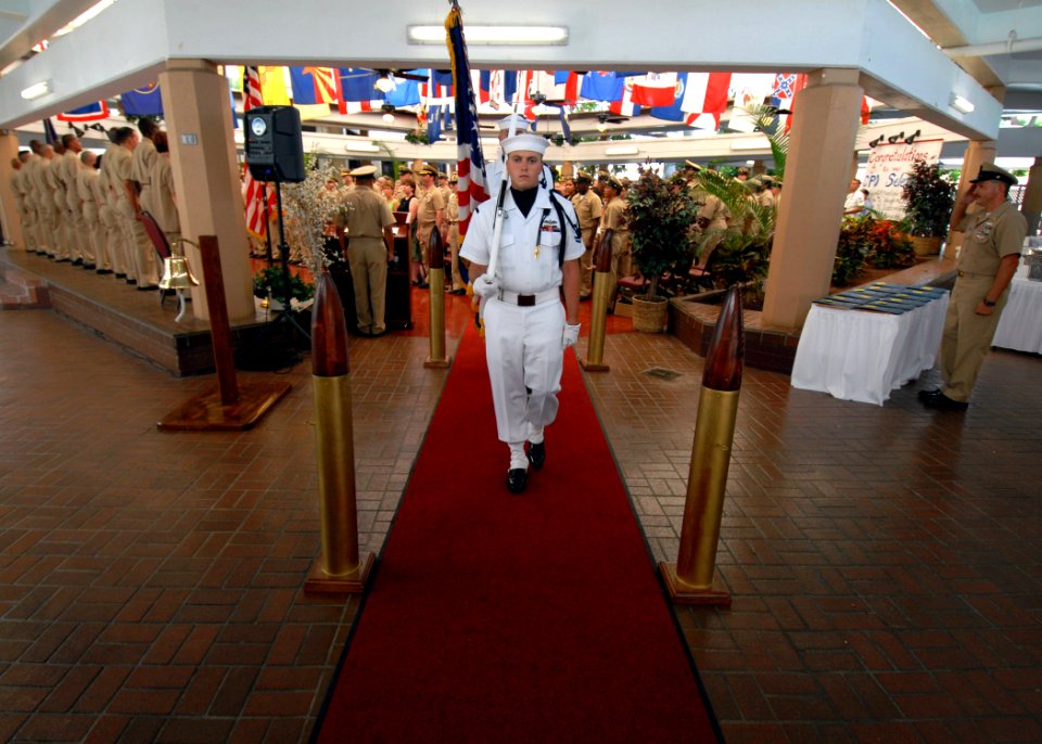 US Navy 070921-N-4965F-003 Sailors assigned to Naval Station Pearl Harbor Honor Guard parade the colors during a chief petty officer pinning ceremony