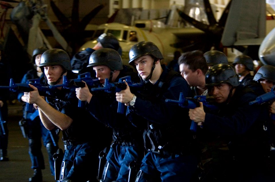 US Navy 070919-N-5387K-051 Shipboard reaction force trainees perform a drill in the hangar bay aboard USS Kitty Hawk (CV 63)
