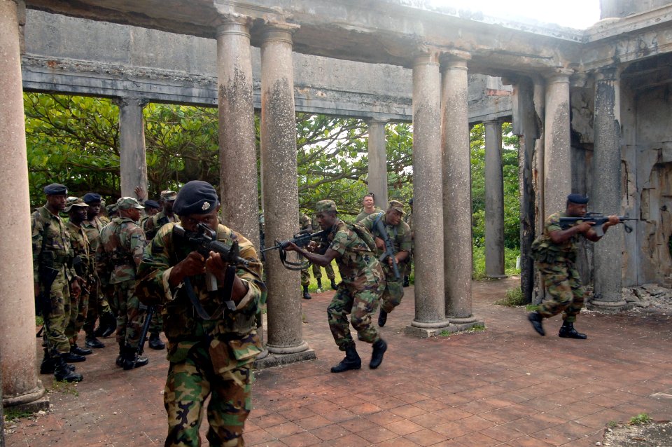 US Navy 070925-N-0989H-396 Members of the Jamaica Defense Force conduct Close Quarters Battle and room clearing drills with U.S. Marines assigned to a mobile training team during small unit training