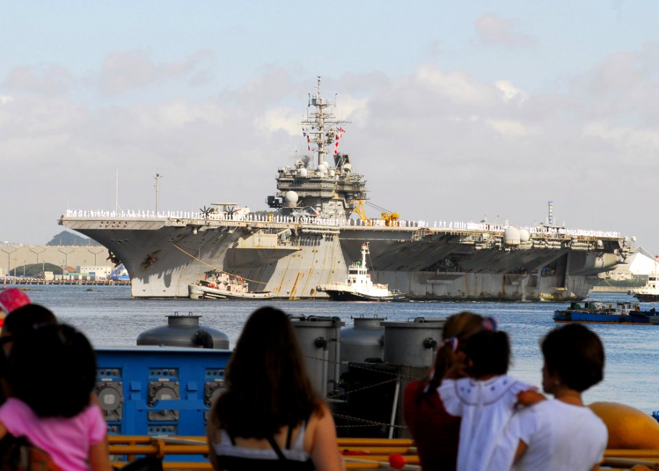 US Navy 070921-N-2638R-003 Sailors man the rails as USS Kitty Hawk (CV 63) returns to Fleet Activities Yokosuka after a four-month summer deployment