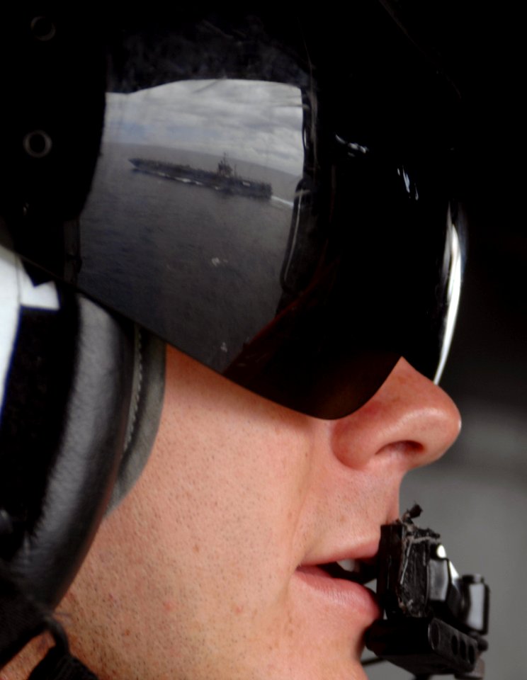 US Navy 070920-N-0535P-311 Aviation Warfare Systems Operator 2nd Class Christopher O'Dell observes Nimitz-class aircraft carrier USS Harry S. Truman (CVN 75) from an SH-60 Seahawk