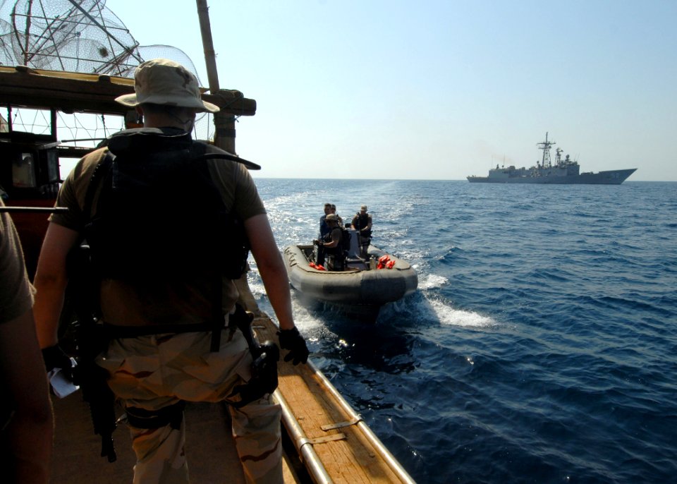 US Navy 070926-N-0841E-118 Boarding team members from the guided-missile frigate USS Carr (FFG 52) render assistance to a United Arab Emirates-flagged fishing dhow as part of an interaction patrol