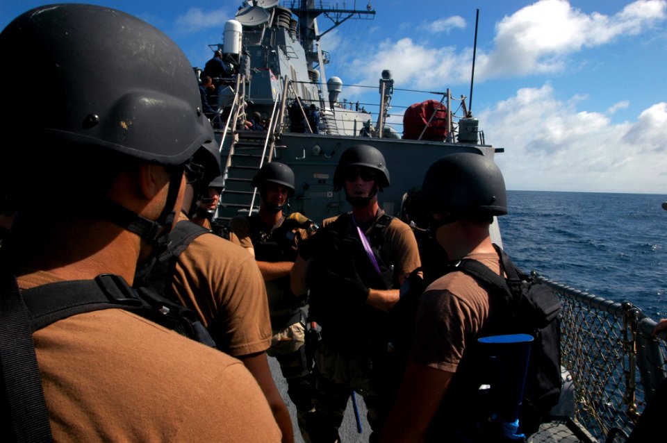 US Navy 070920-N-4014G-091 Members of the visit, board, search and seizure team aboard guided-missile destroyer USS Porter (DDG 78) are briefed prior to conducting an exercise
