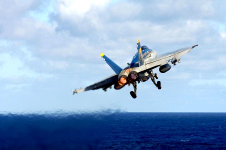 US Navy 070919-N-7883G-022 An F-A-18C Hornet from the Golden Dragons of Strike Fighter Squadron (VFA) 192 launches from the flight deck aboard USS Kitty Hawk (CV 63)