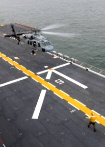 US Navy 070921-N-4856C-084 An SH-60 Seahawk lands on the flight deck of amphibious assault ship USS Iwo Jima (LHD 7)