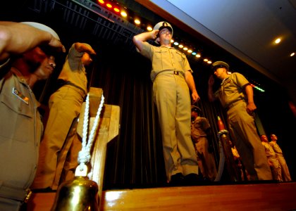 US Navy 070920-N-6936D-003 A newly pinned chief petty officer is piped aboard after receiving his anchors during a pinning ceremony held at Fleet Activities Sasebo