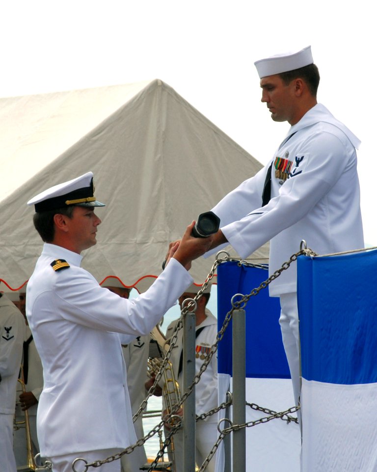 US Navy 070926-N-6936D-064 Chief Mate William Woodman, attached to Military Sealift Command (MSC), relieves Navy Diver 2nd Class Ryan S. Steinkamp of the watch during the decommissioning ceremony