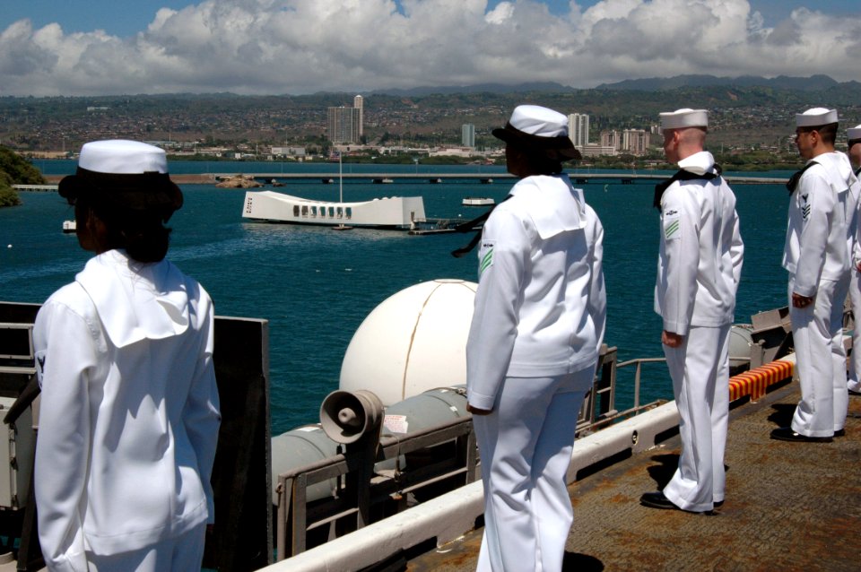 US Navy 070922-N-7128A-009 Sailors man the rails as nuclear-powered aircraft carrier USS Nimitz (CVN 68) passes by the USS Arizona Memorial. Nimitz made a two-day visit to embark guests for a Tiger Cruise to San Diego