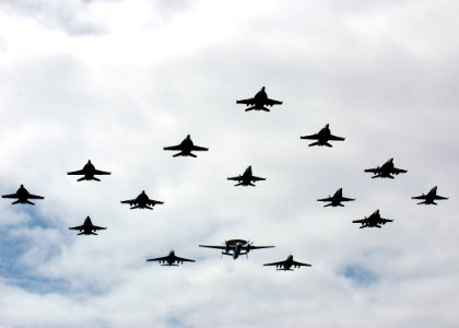 US Navy 070926-N-7128A-065 Aircraft assigned to Carrier Air Wing (CVW) 11 fly in formation over the flight deck of the nuclear-powered aircraft carrier USS Nimitz (CVN 68) during a Tiger Cruise air power demonstration