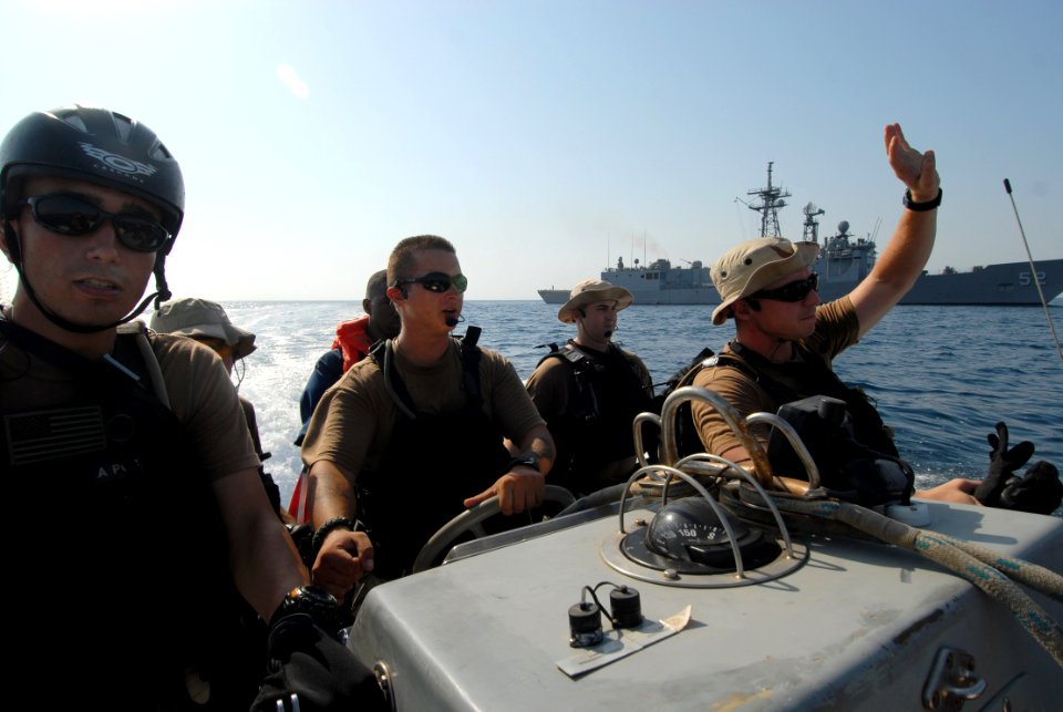 US Navy 070926-N-0841E-035 Team members of the visit, board, search and seizure team assigned to guided-missile frigate USS Carr (FFG 52) prepare to visit to a fishing dhow as part of an interaction patrol