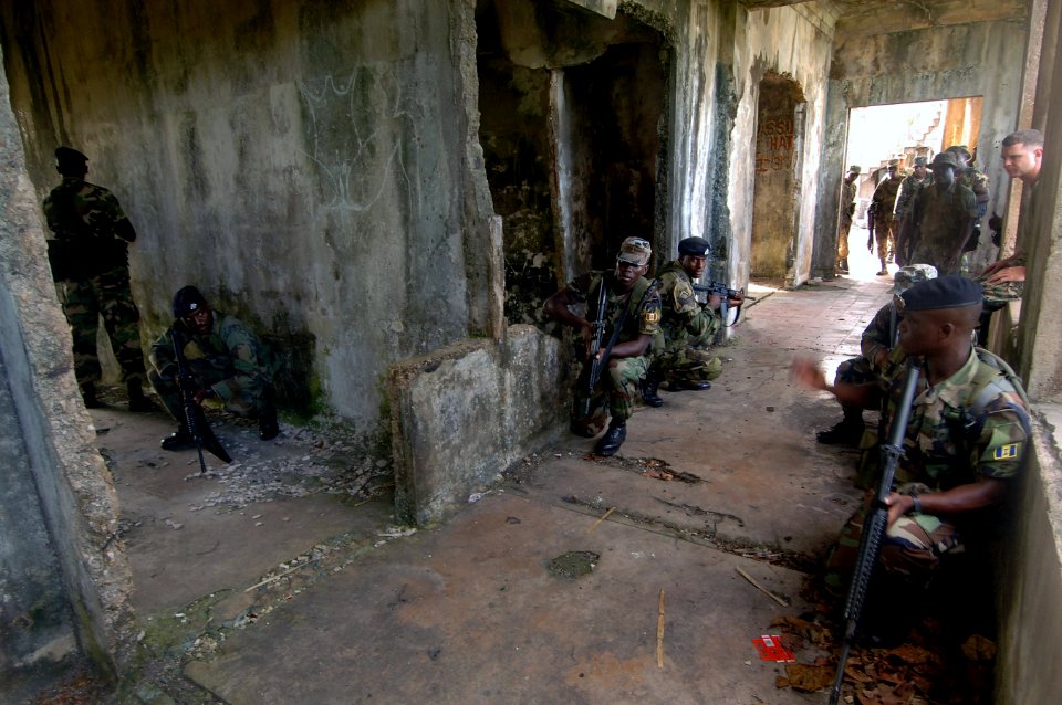 US Navy 070925-N-0989H-436 U.S. Marines assigned to a mobile training team conduct Close Quarters Battle and room clearing drills with members of the Jamaica Defense Force